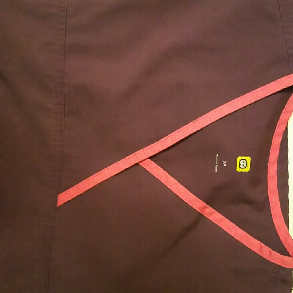 Purple scrub top trimmed in pink